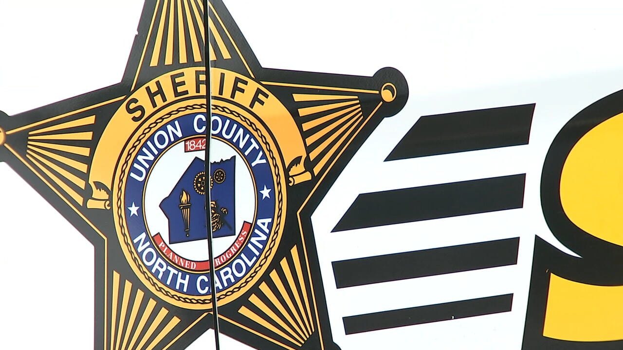 Gold star-shaped sheriff's badge reading Union County North Carolina.