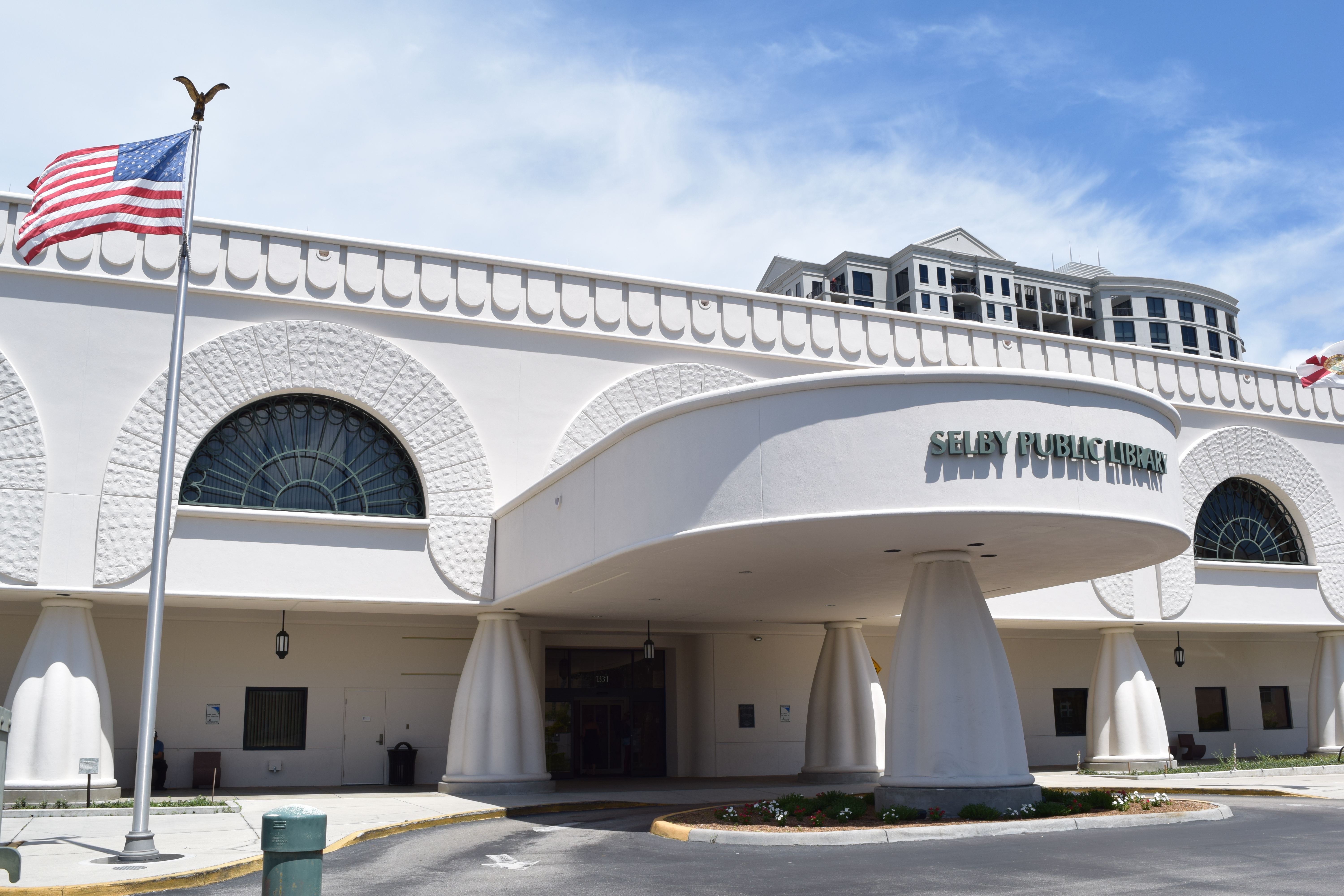 Front exterior view of Selby Public Library, a modern building in downtown Sarasota.
