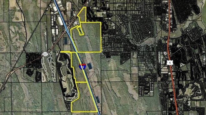 Aerial satellite map with yellow outlines marking two large parcels near Interstate 95.