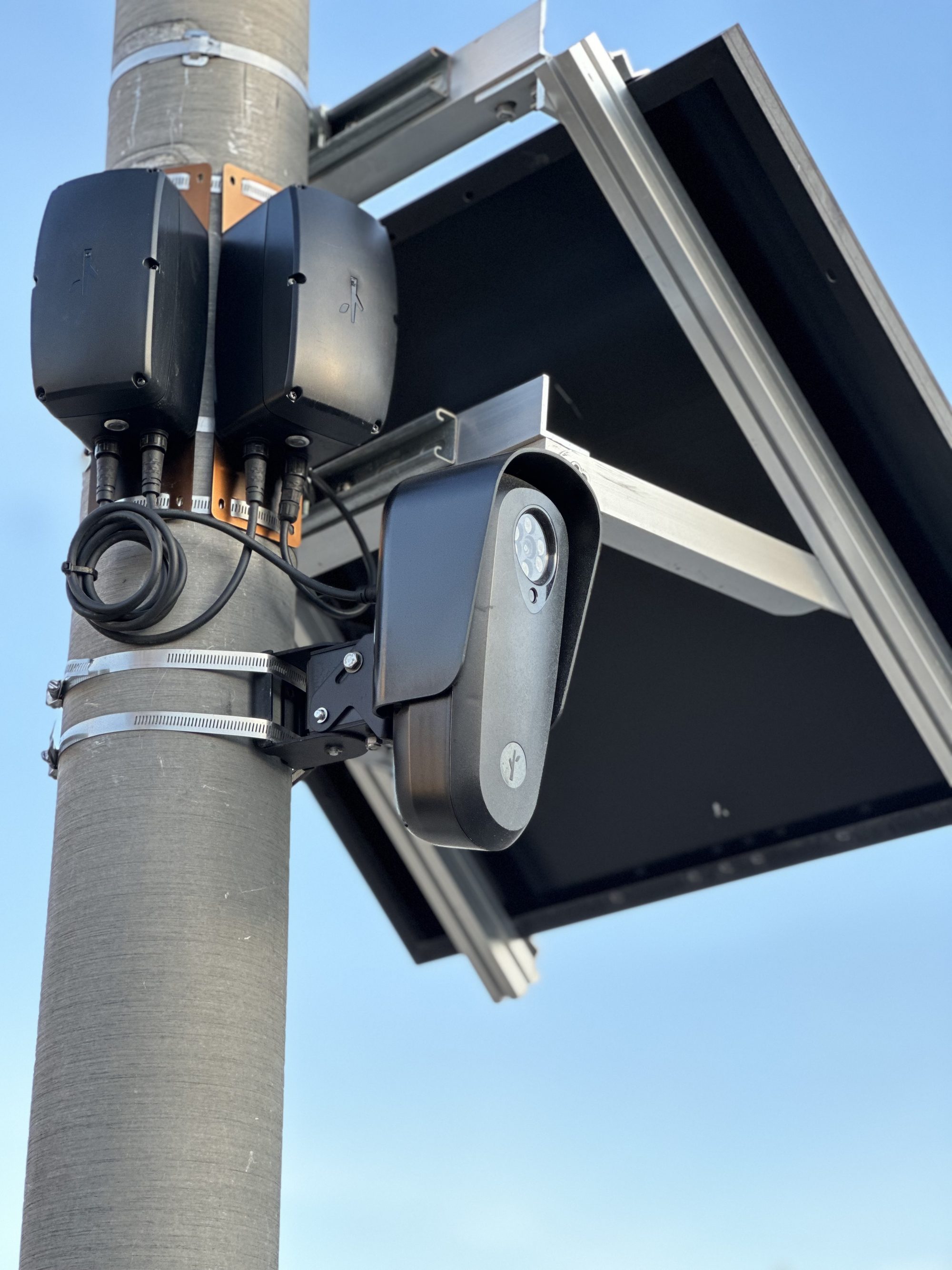 Close up of Flock camera attached to a street light pole