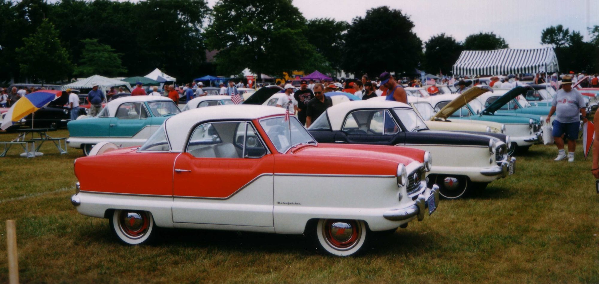 View of the automobiles at the Metropolitan Automobile Car Club meet held in Kenosha, Wisconsin. Part of the "100th Anniversary Celebration of the Rambler" events that was held in the park overlooking Lake Michigan.