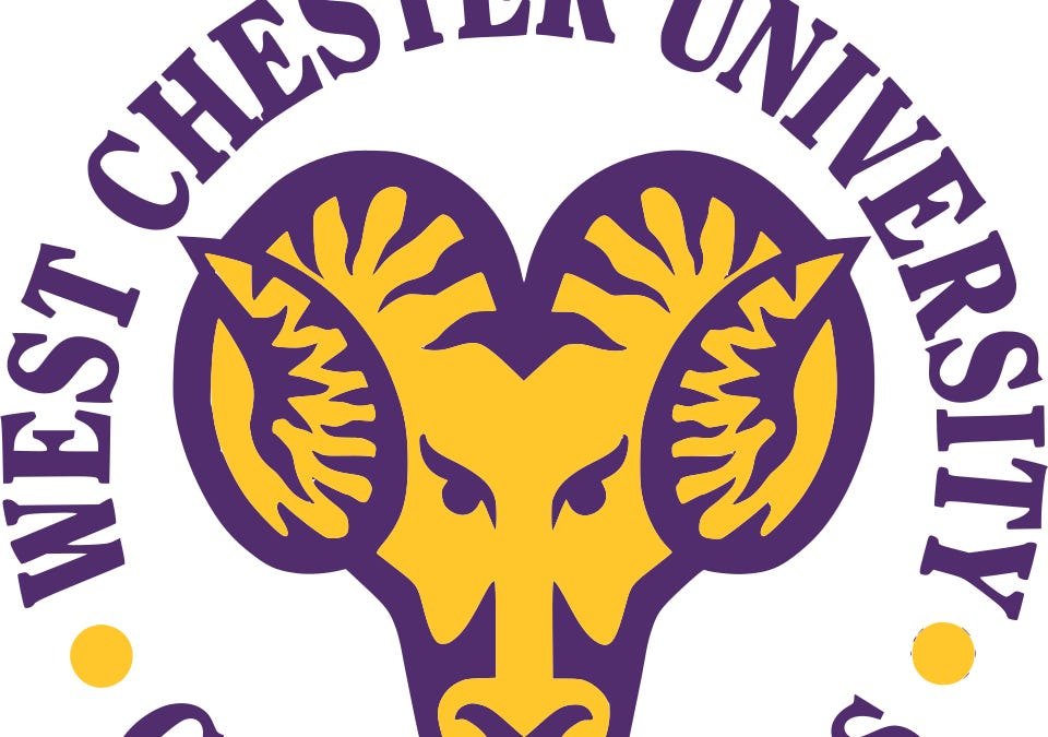Circular athletic logo featuring a golden ram's head in purple and gold.