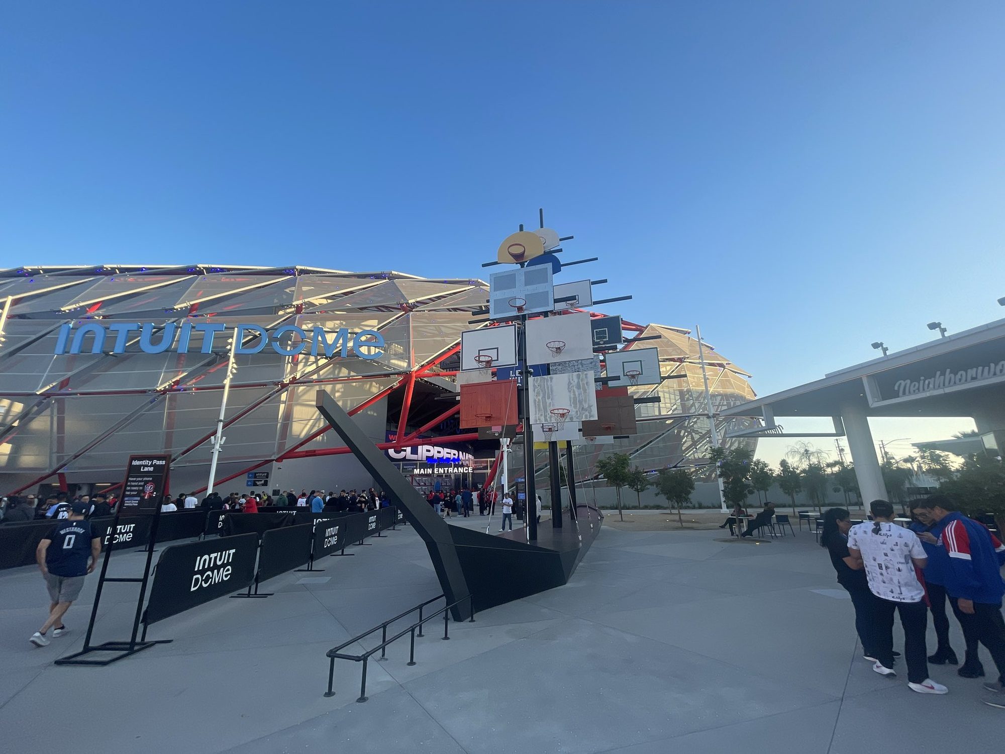 A picture of the main entrance of the Intuit Dome getting ready for the first nba game at the Intuit Dome. Clippers backboards Sails Ship..