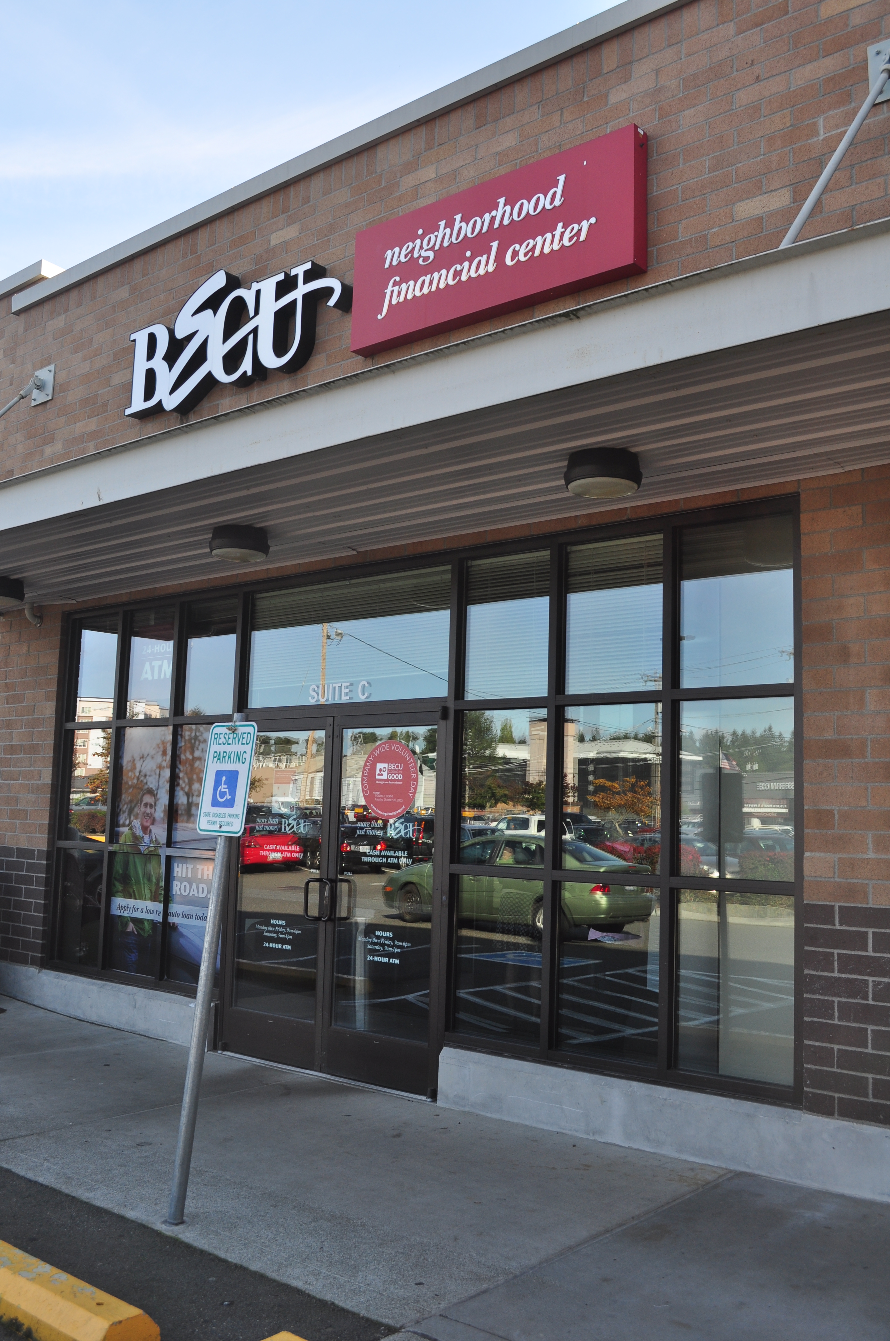 Exterior of a BECU credit union branch building on a city street.
