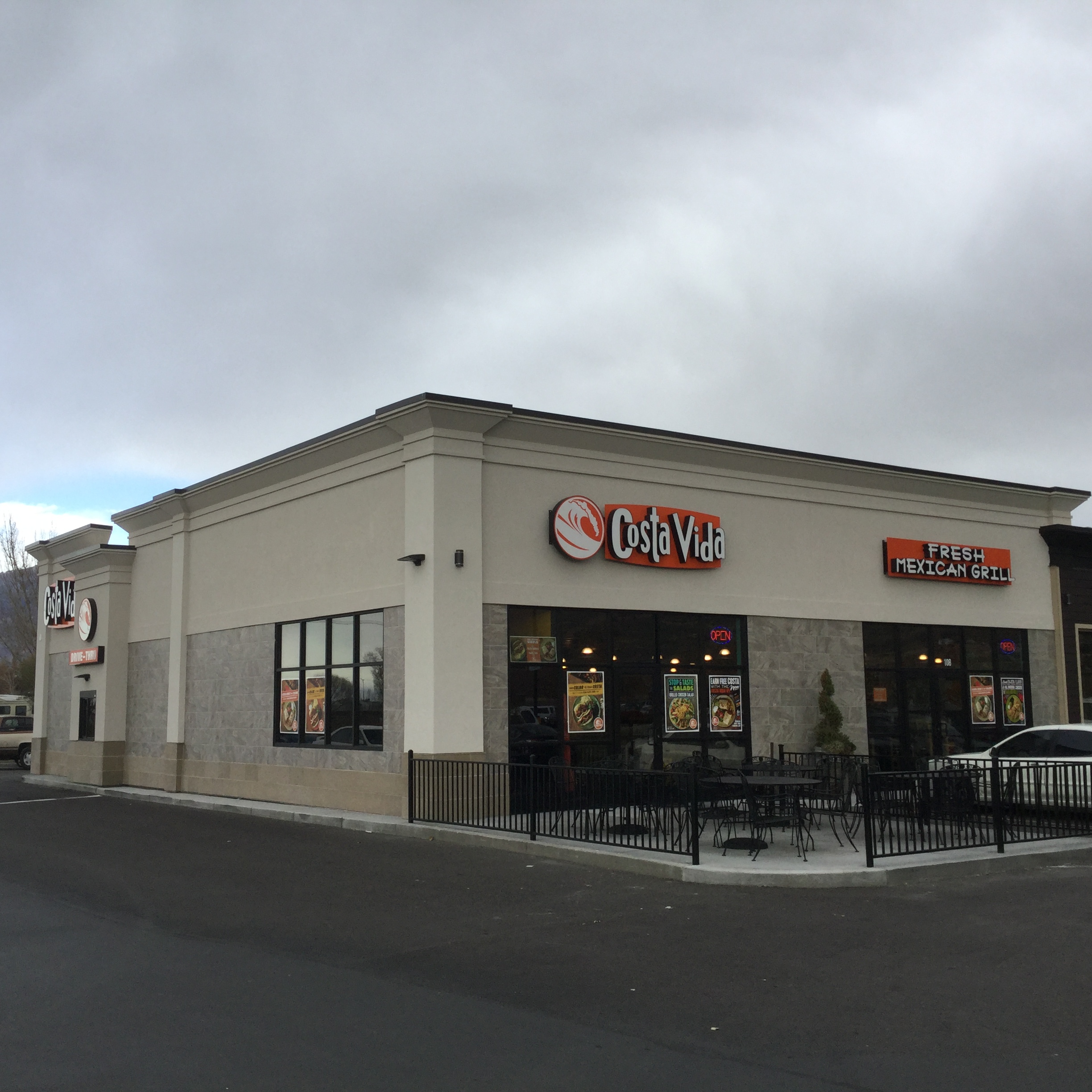 Exterior of a Costa Vida Fresh Mexican Grill with branded signage and outdoor patio seating.