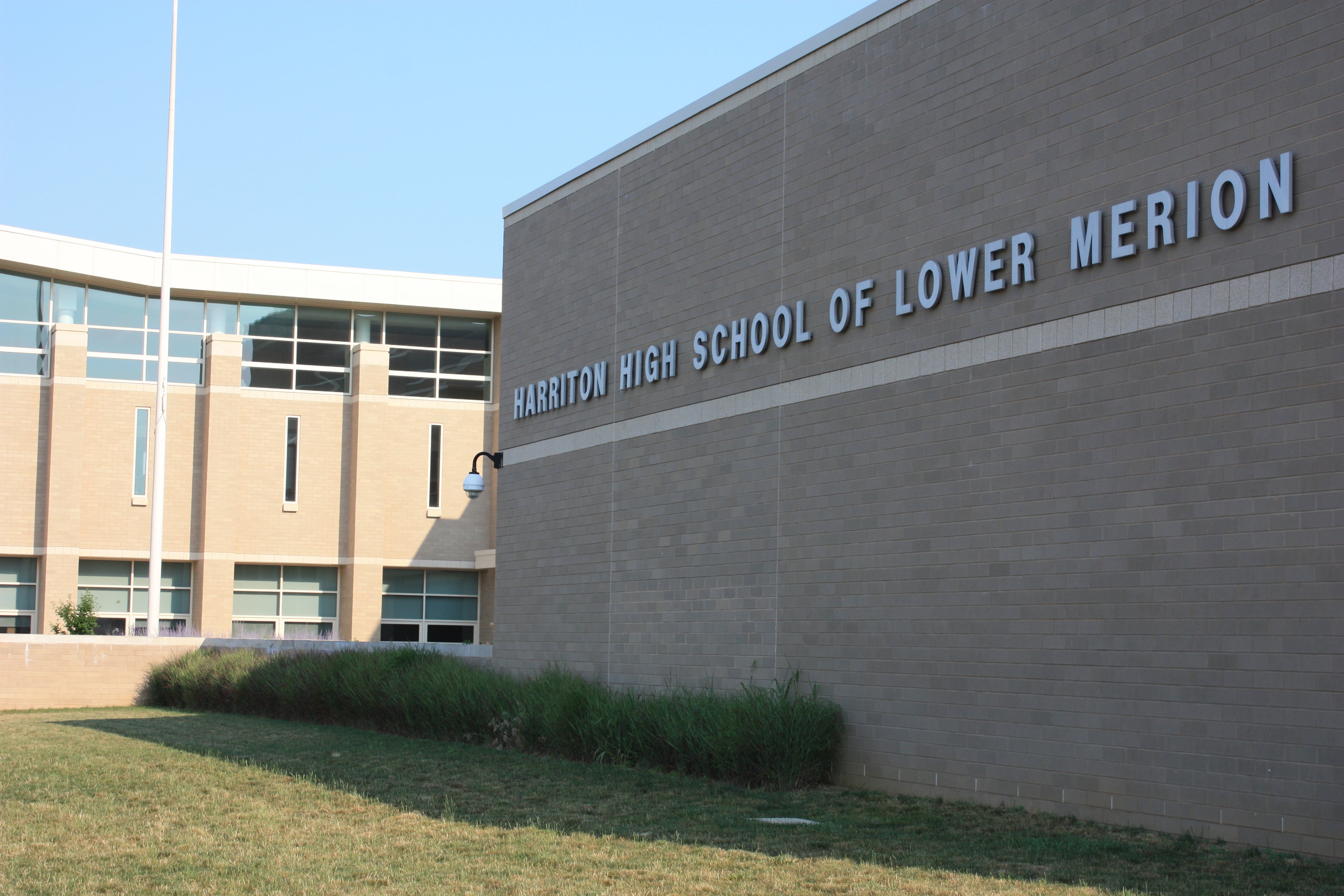 Brick exterior of a school building with the name Harriton High School on the wall.