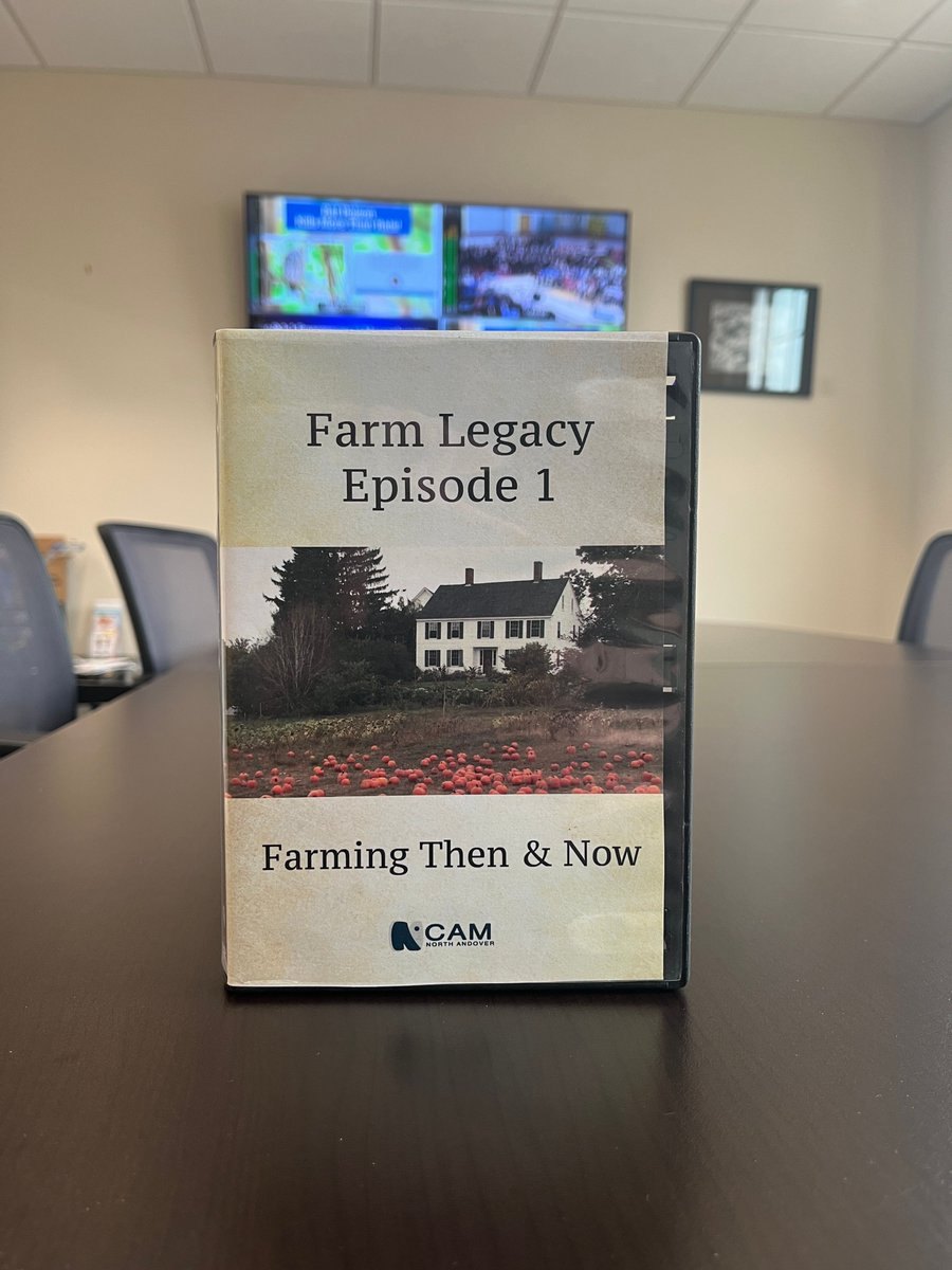 A DVD case titled Farm Legacy Episode 1 standing upright on a dark table.