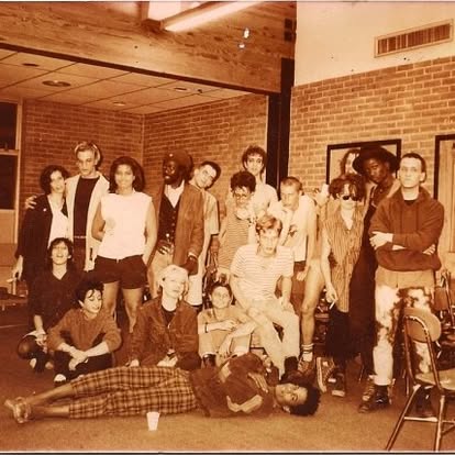 Group of students posed indoors at a high school in a sepia-toned 1985 photograph.