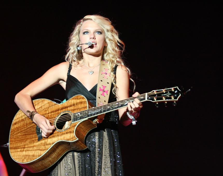 American country musician Taylor Swift performing live.
