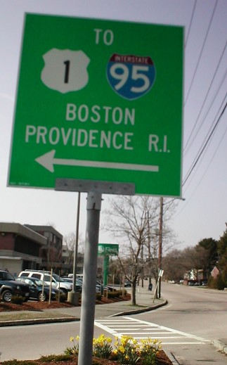 Green directional road sign on Washington Street in Dedham, Massachusetts.