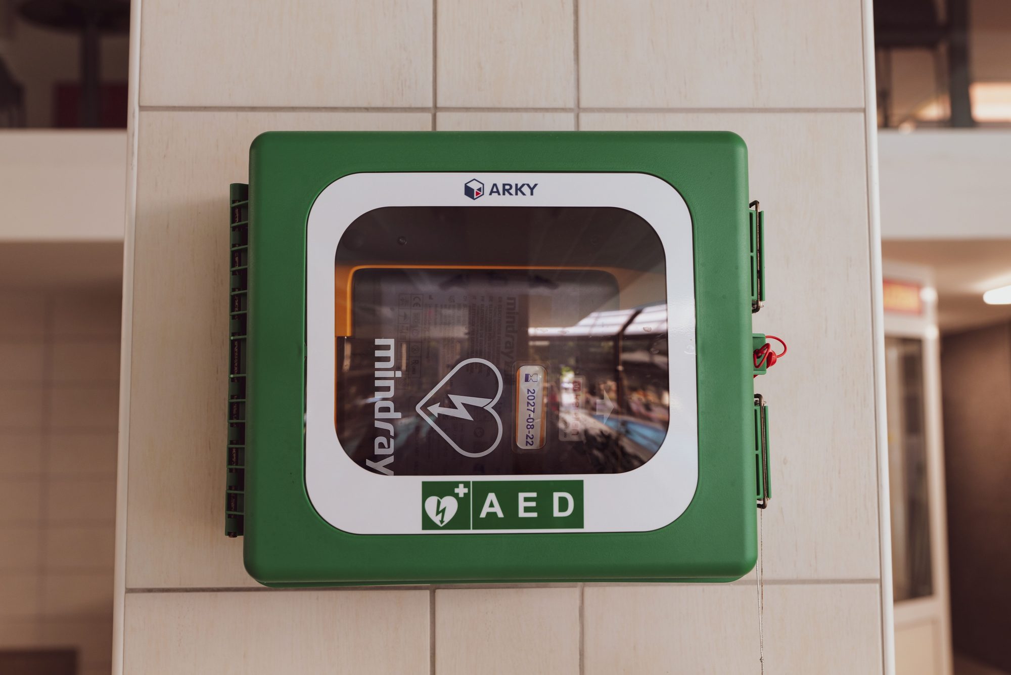 A close-up shot of a wall-mounted AED device in Stubičke Toplice, Croatia.