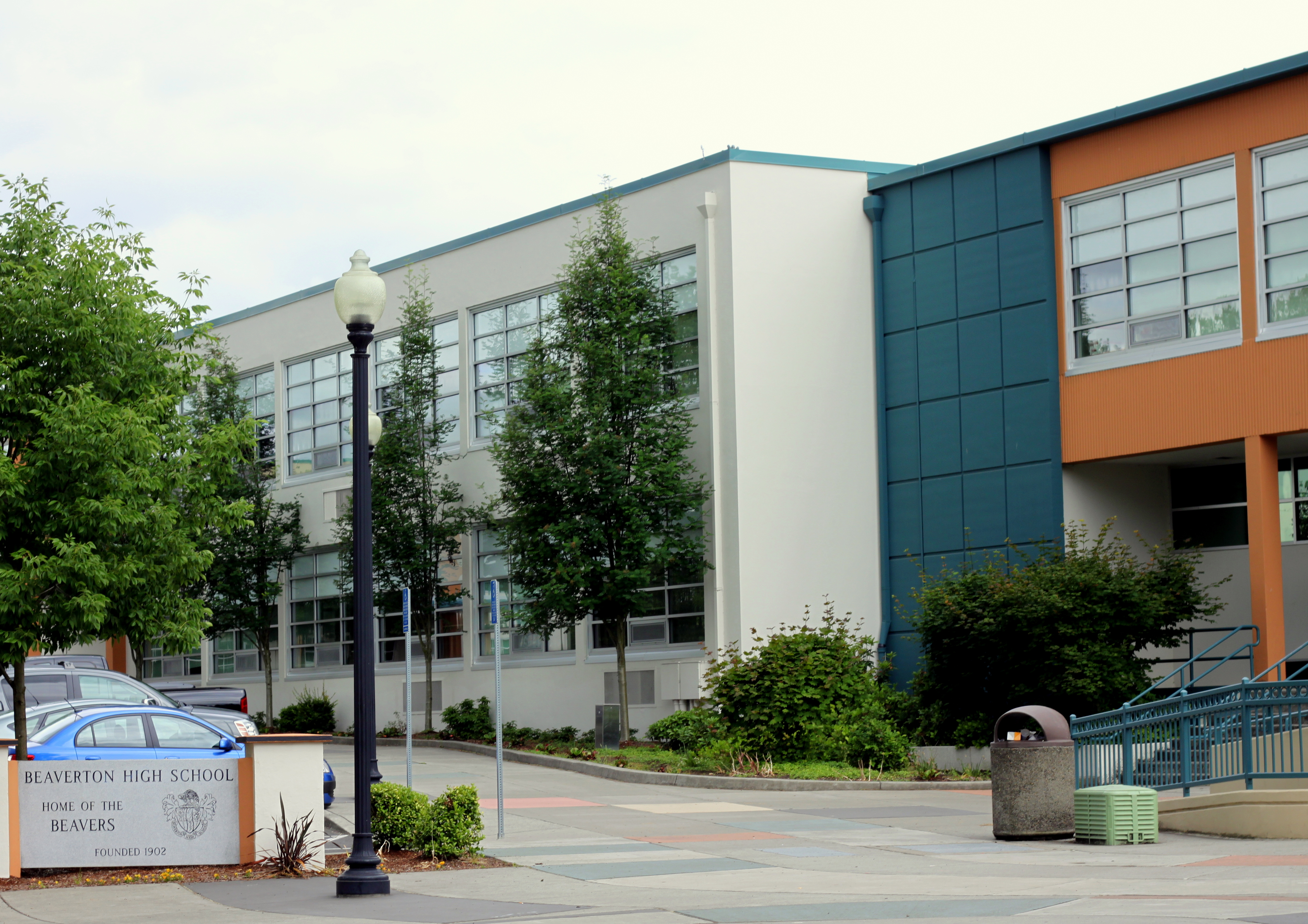 Exterior of a school building with a sign reading Beaverton High School, Home of the Beavers.