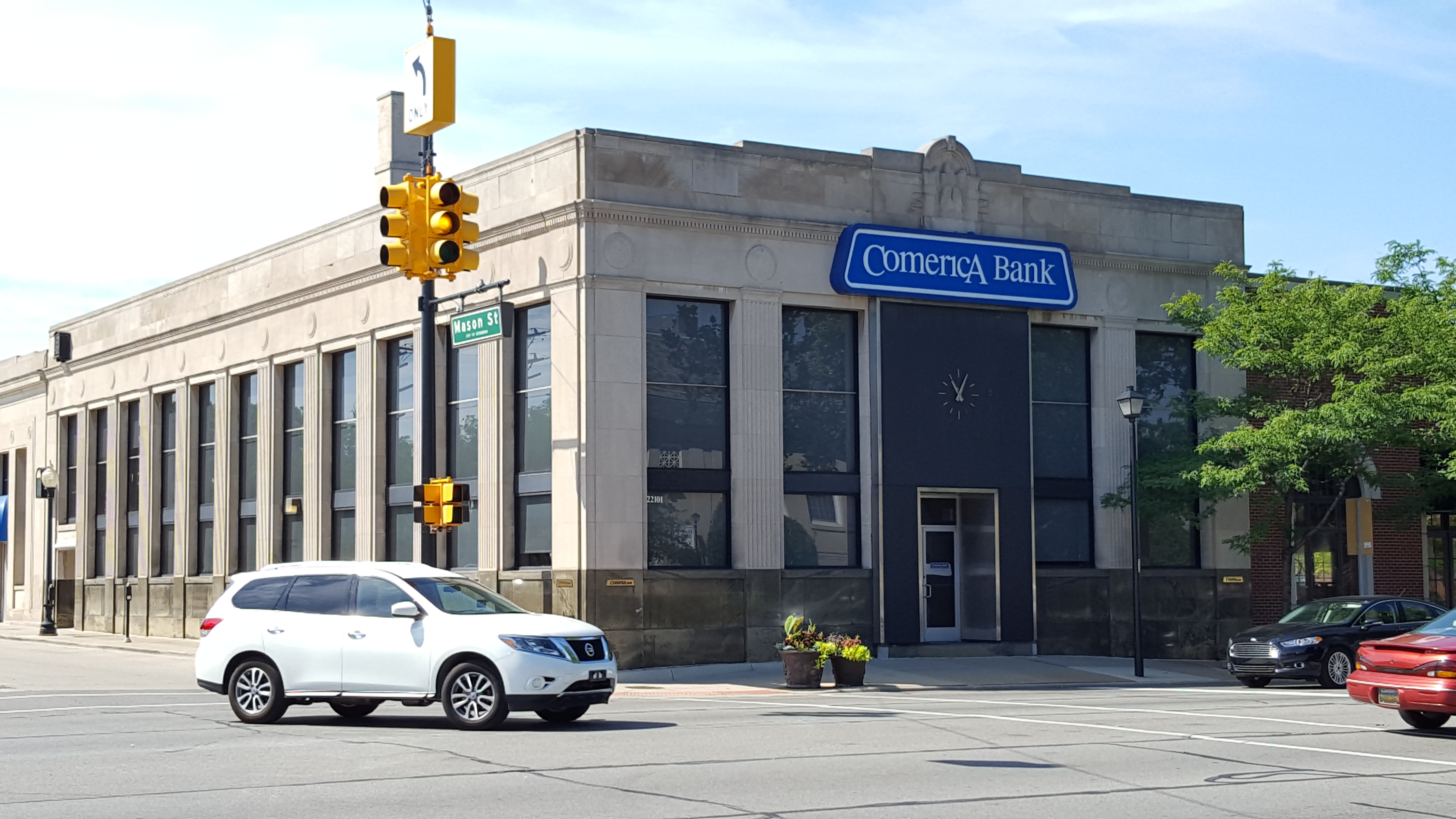Comerica Bank branch building on a street corner with blue signage.