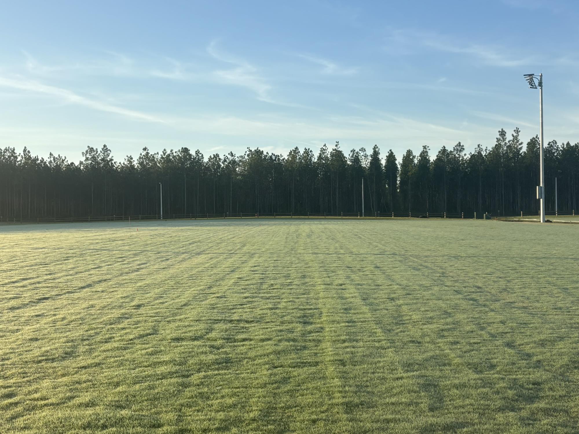 A multipurpose grass field and floodlight at Clay County Regional Sports Complex in Middleburg.
