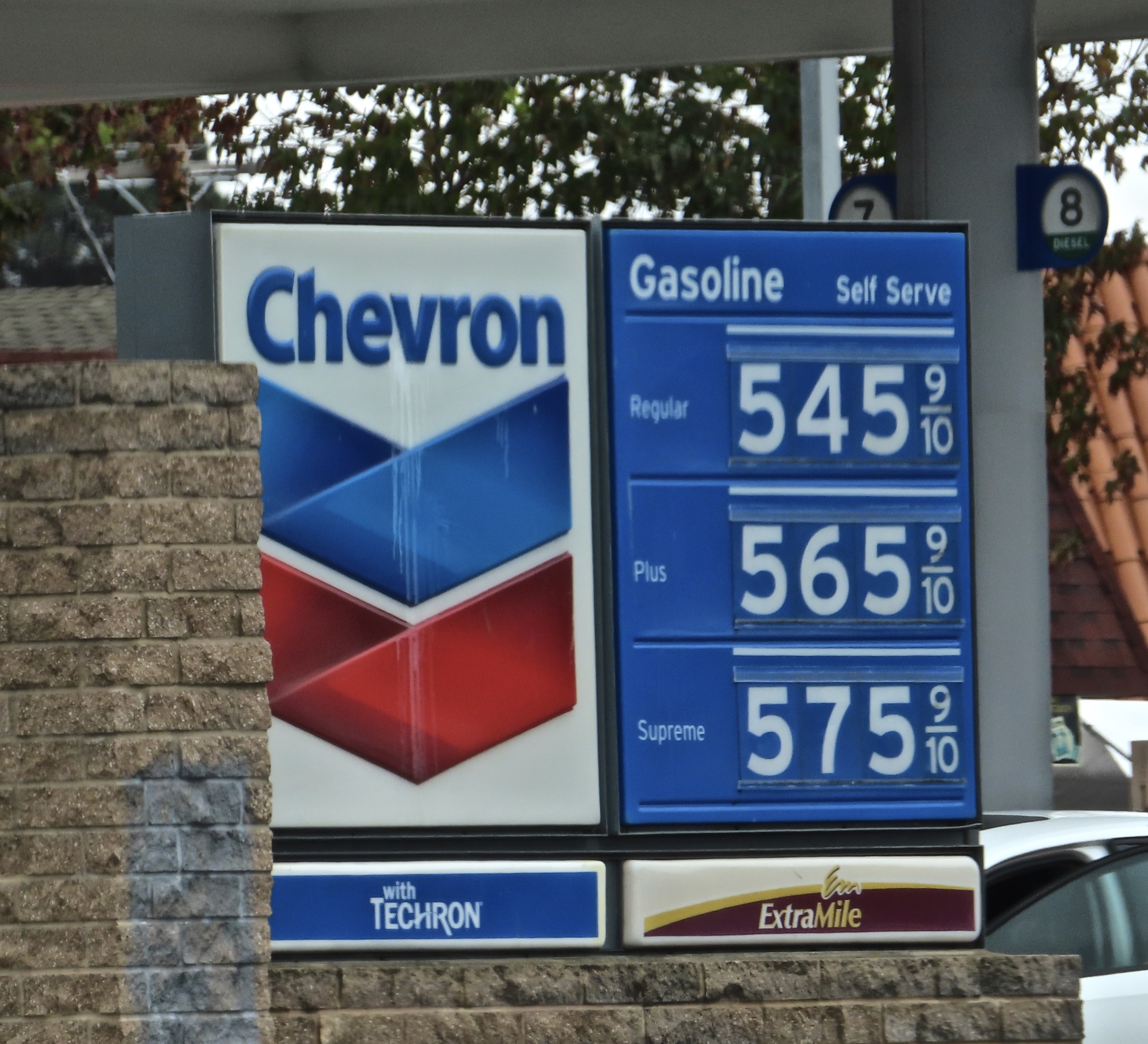 Chevron gas station sign showing fuel prices above five dollars per gallon.