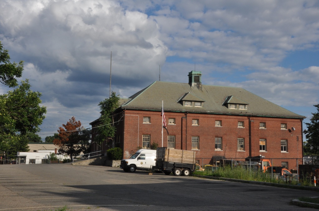 Large red-brick building with green hip roof on Crafts Street in Newton, Massachusetts.