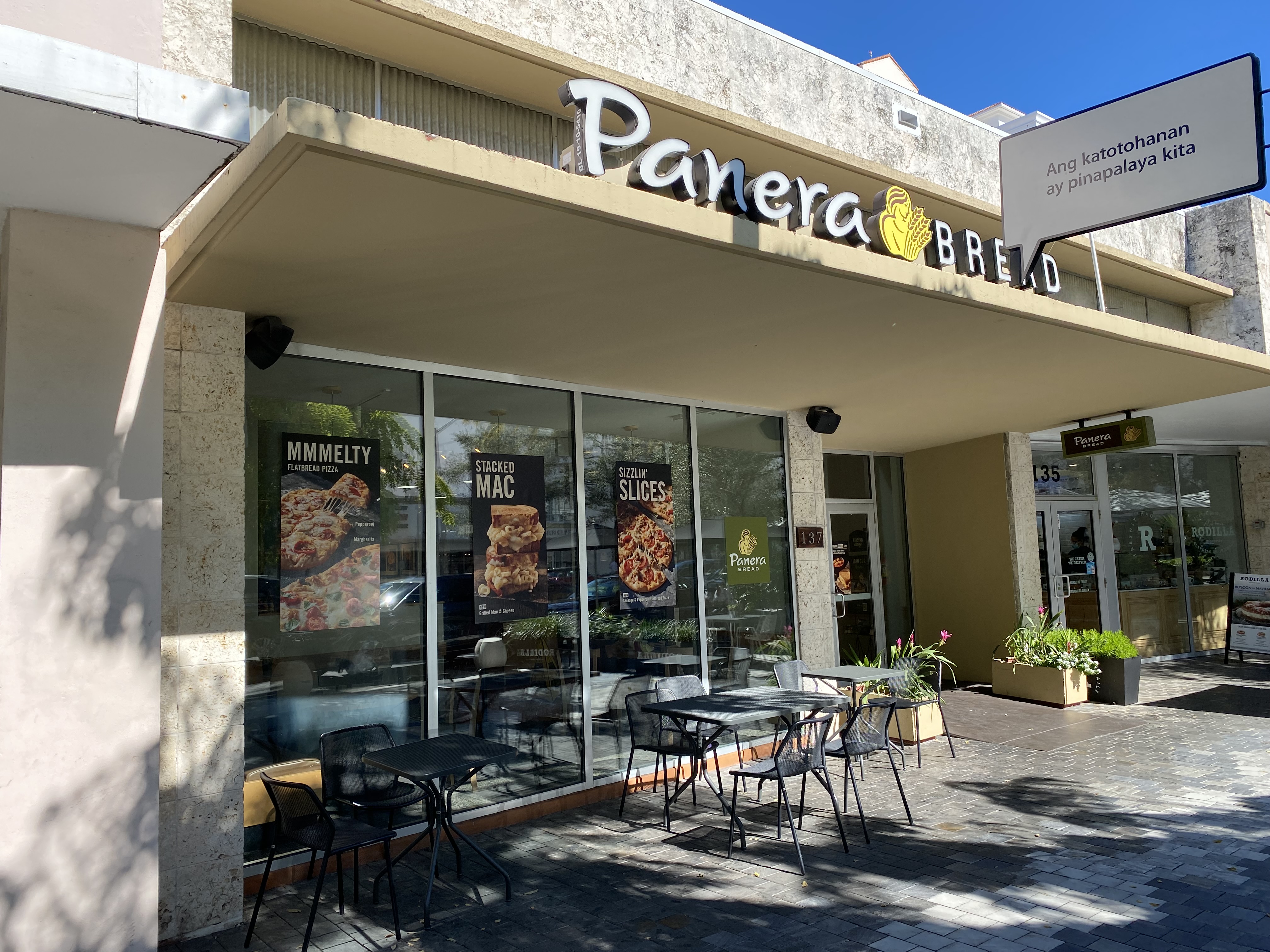Restaurant exterior with outdoor patio seating on a Coral Gables sidewalk.