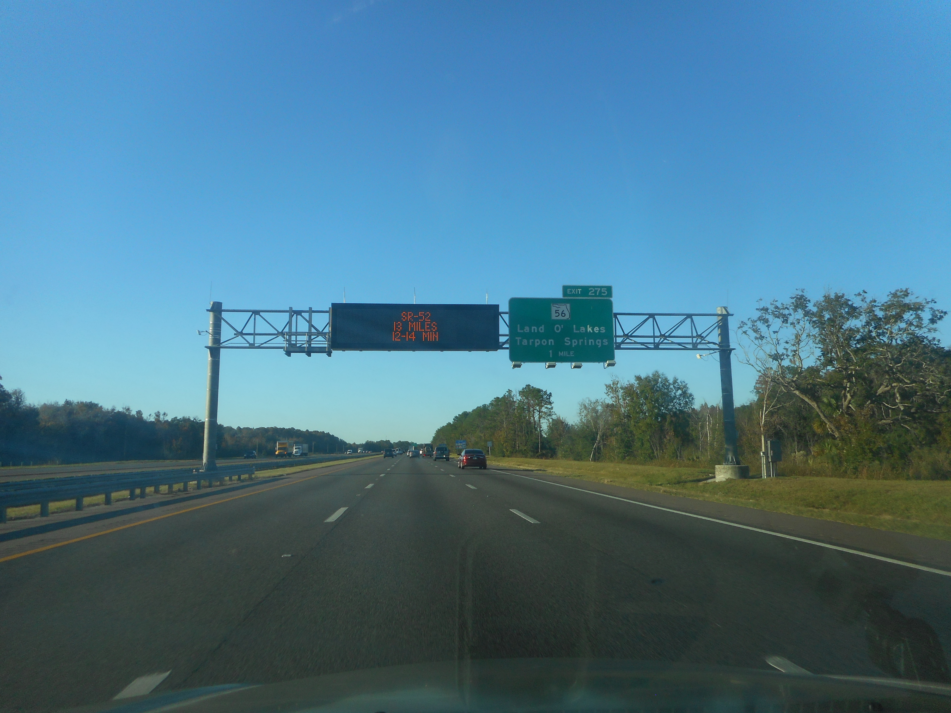 Northbound Interstate 75 with overhead exit sign near the Hillsborough-Pasco County line.