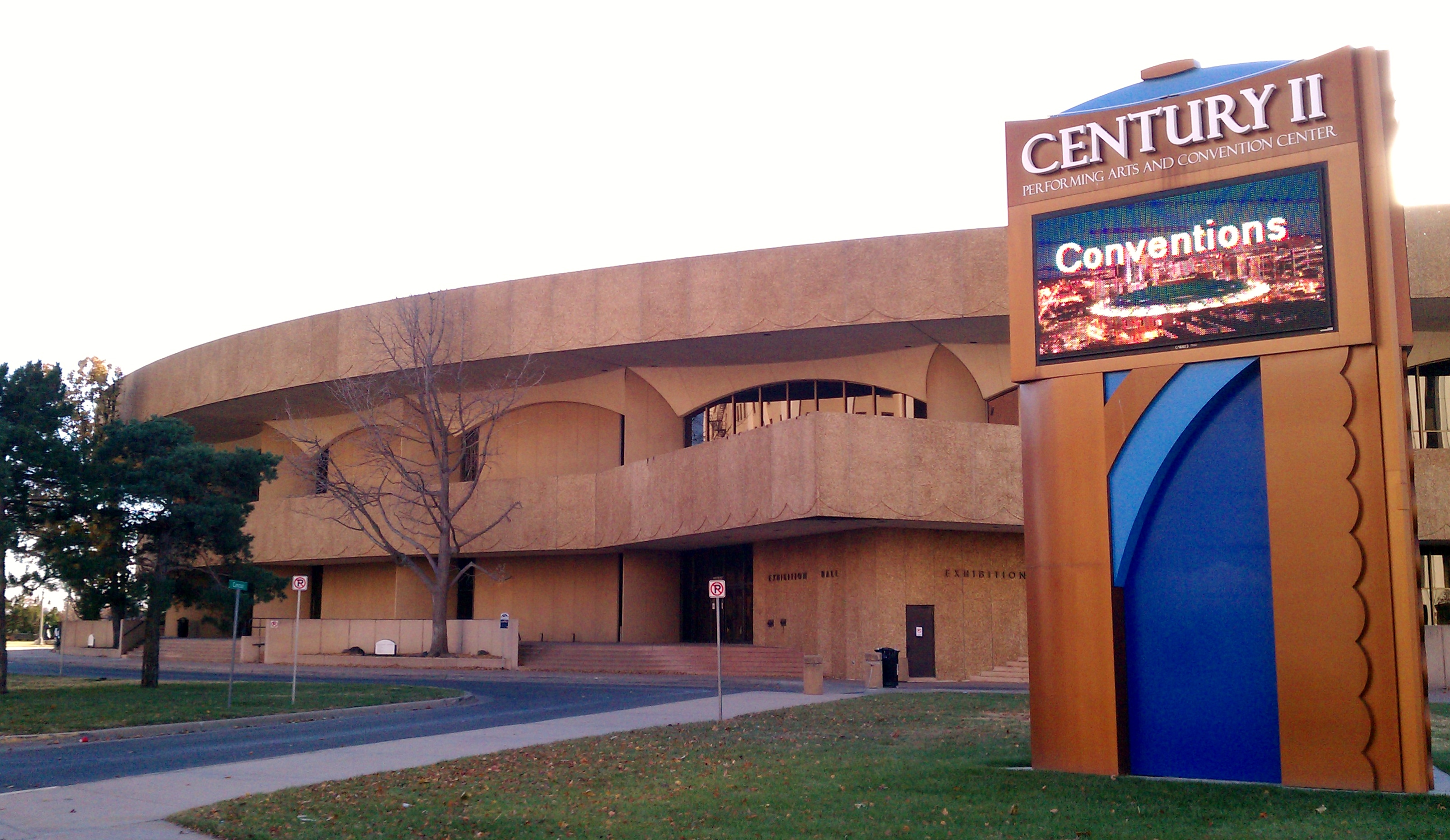 Circular tiered building with a large sign reading Century II Performing Arts and Convention Center.