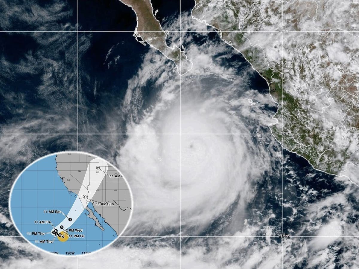 Satellite view of a tropical storm system over the eastern Pacific with a projected track map inset.