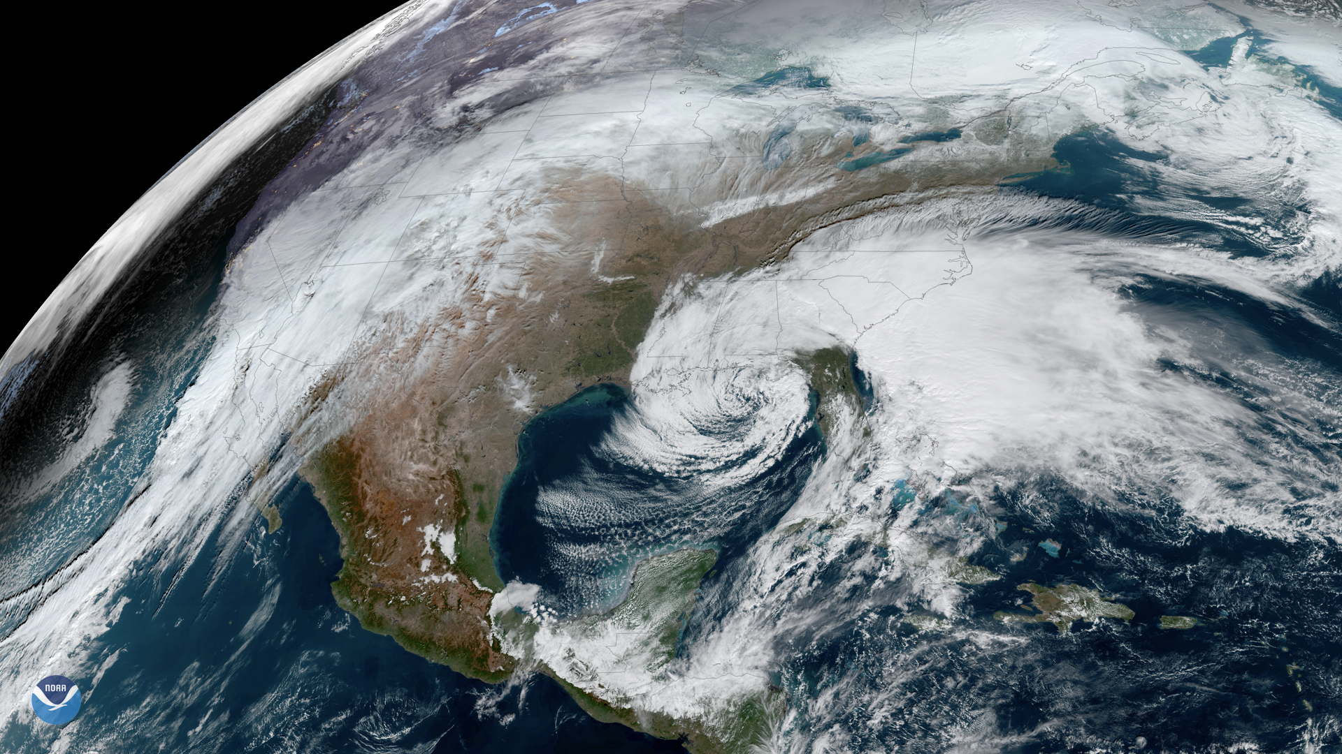 Satellite image showing a swirling storm system over the eastern United States.