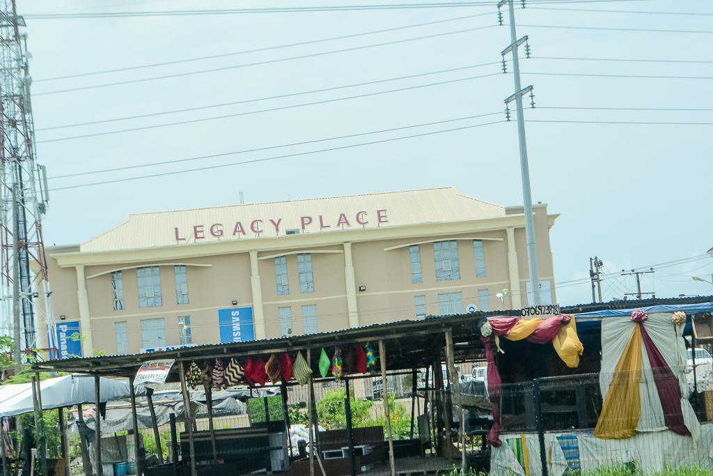 Multi-story commercial building with Legacy Place signage on its facade.