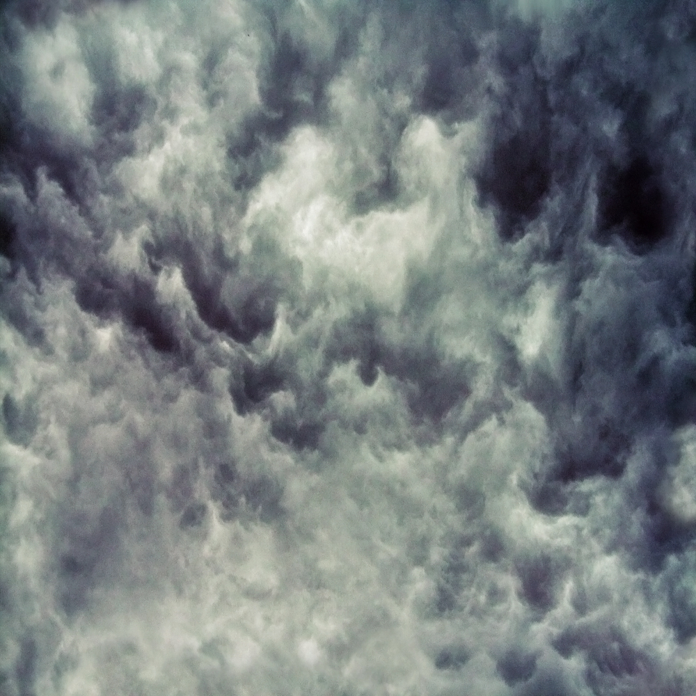 Dark, turbulent storm clouds filling the entire sky.