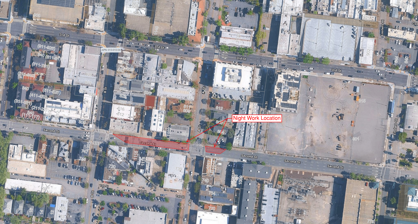 Aerial map with a red highlighted block labeled Night Work Location on a downtown street grid.