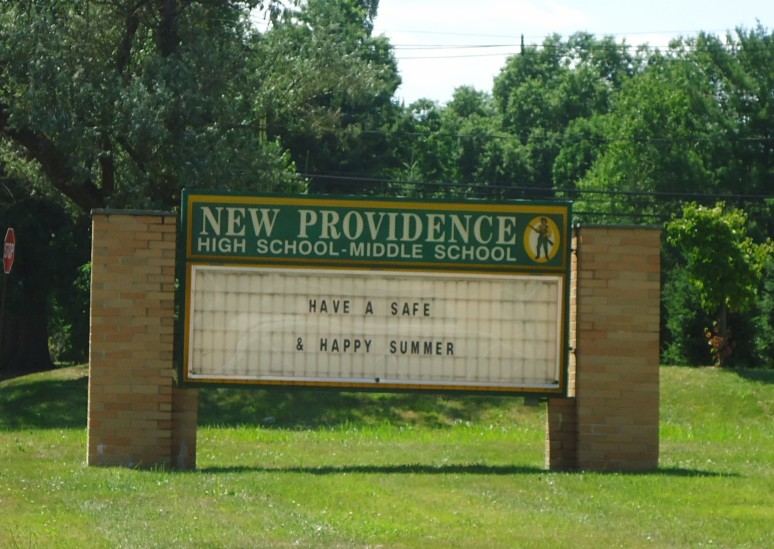 Brick marquee sign reading New Providence High School-Middle School with a changeable letter board.