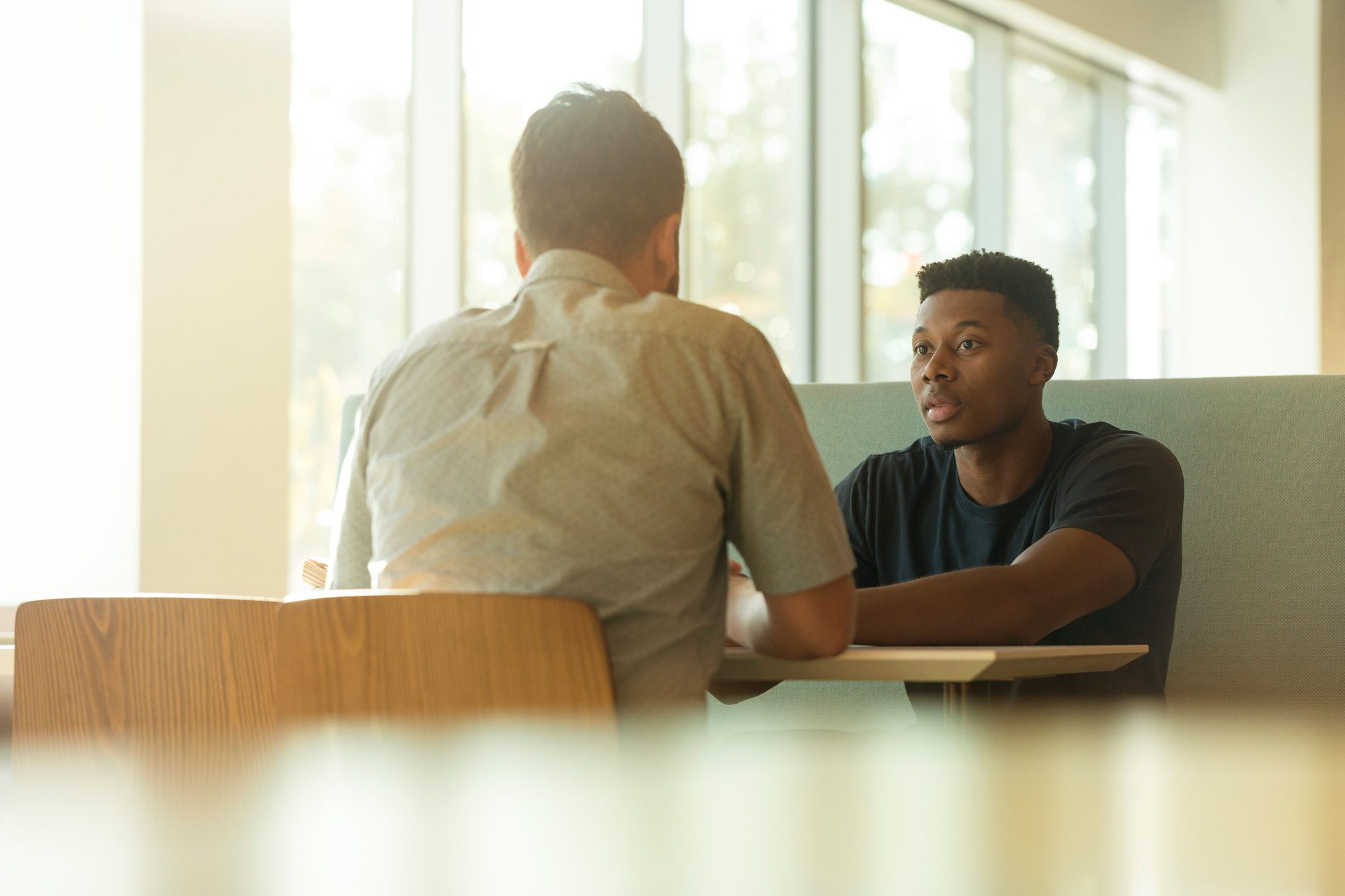 A student discusses his options during a one-on-one advising session.
