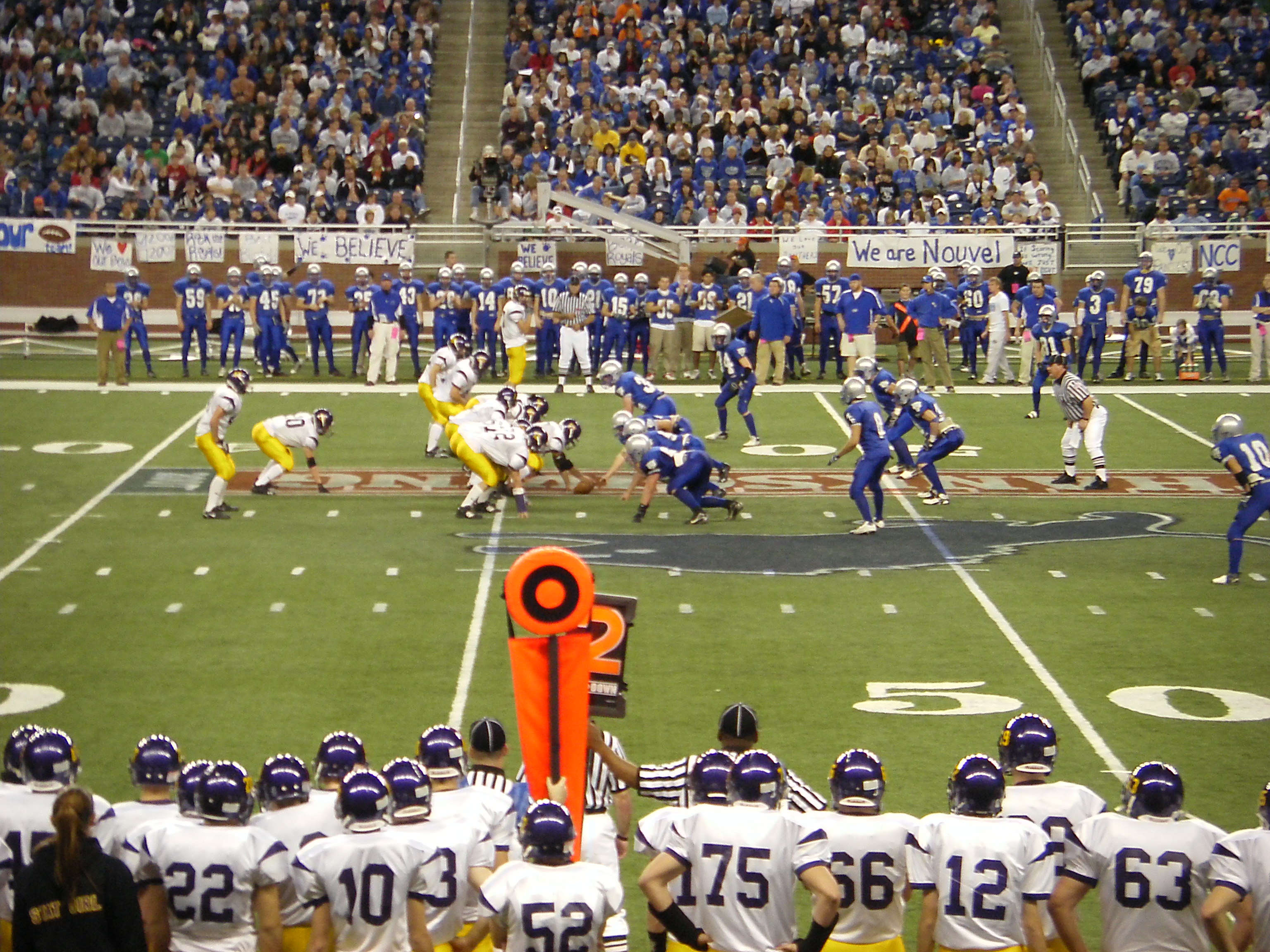 High school football players in action on the field during a game.