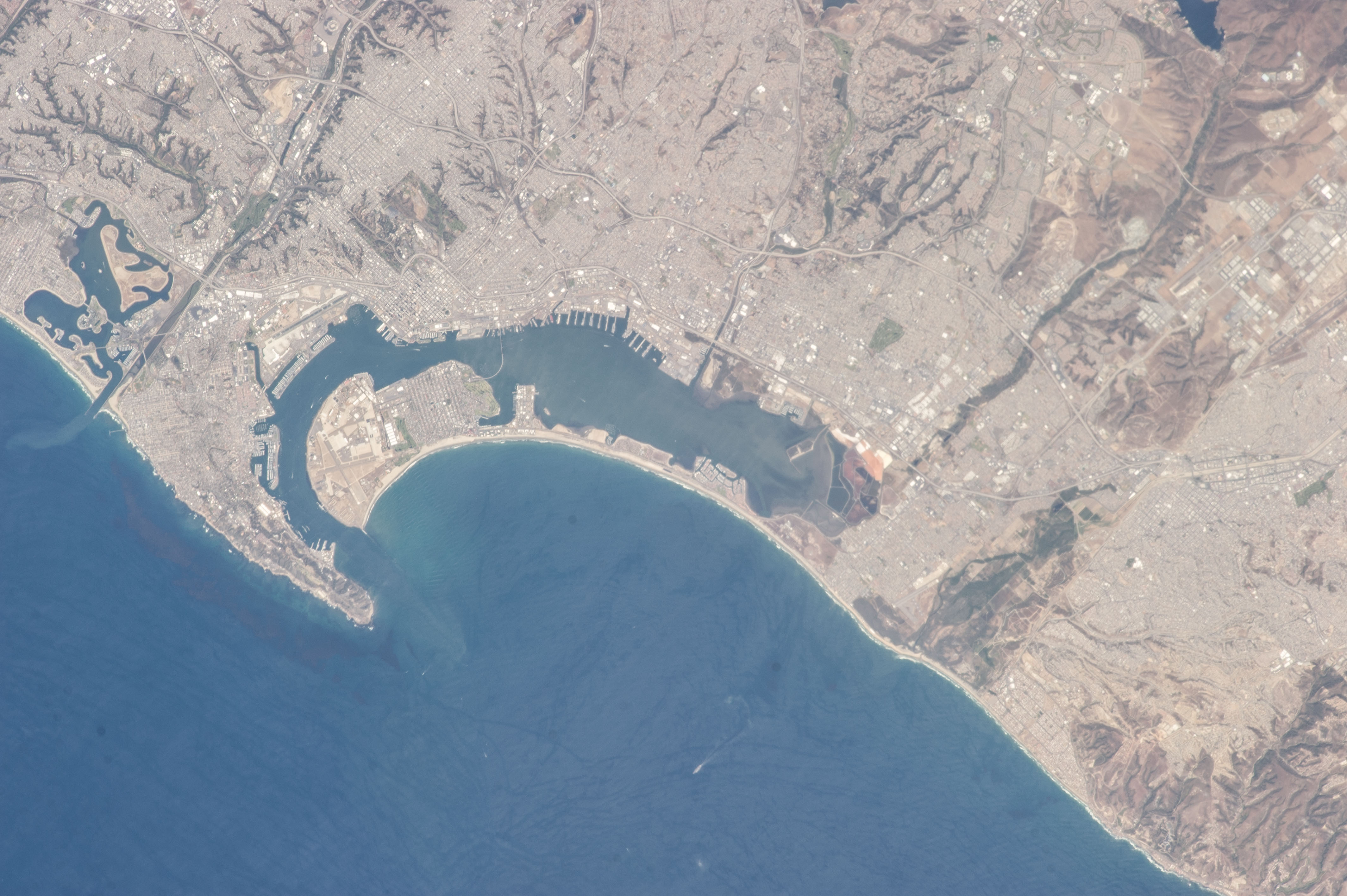 Satellite photo showing San Diego Bay, Coronado peninsula, and the US-Mexico border.