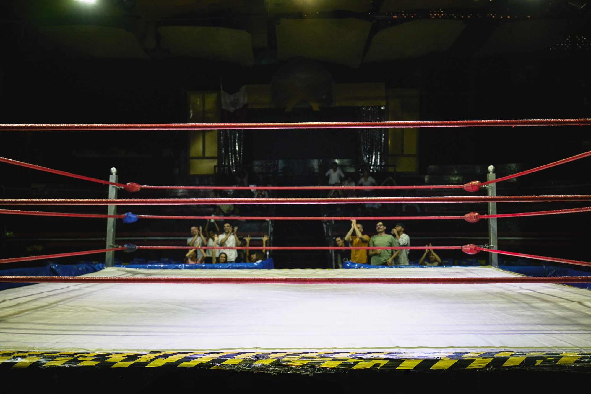 Wide shot empty wrestling ring in stadium before lucha libre match