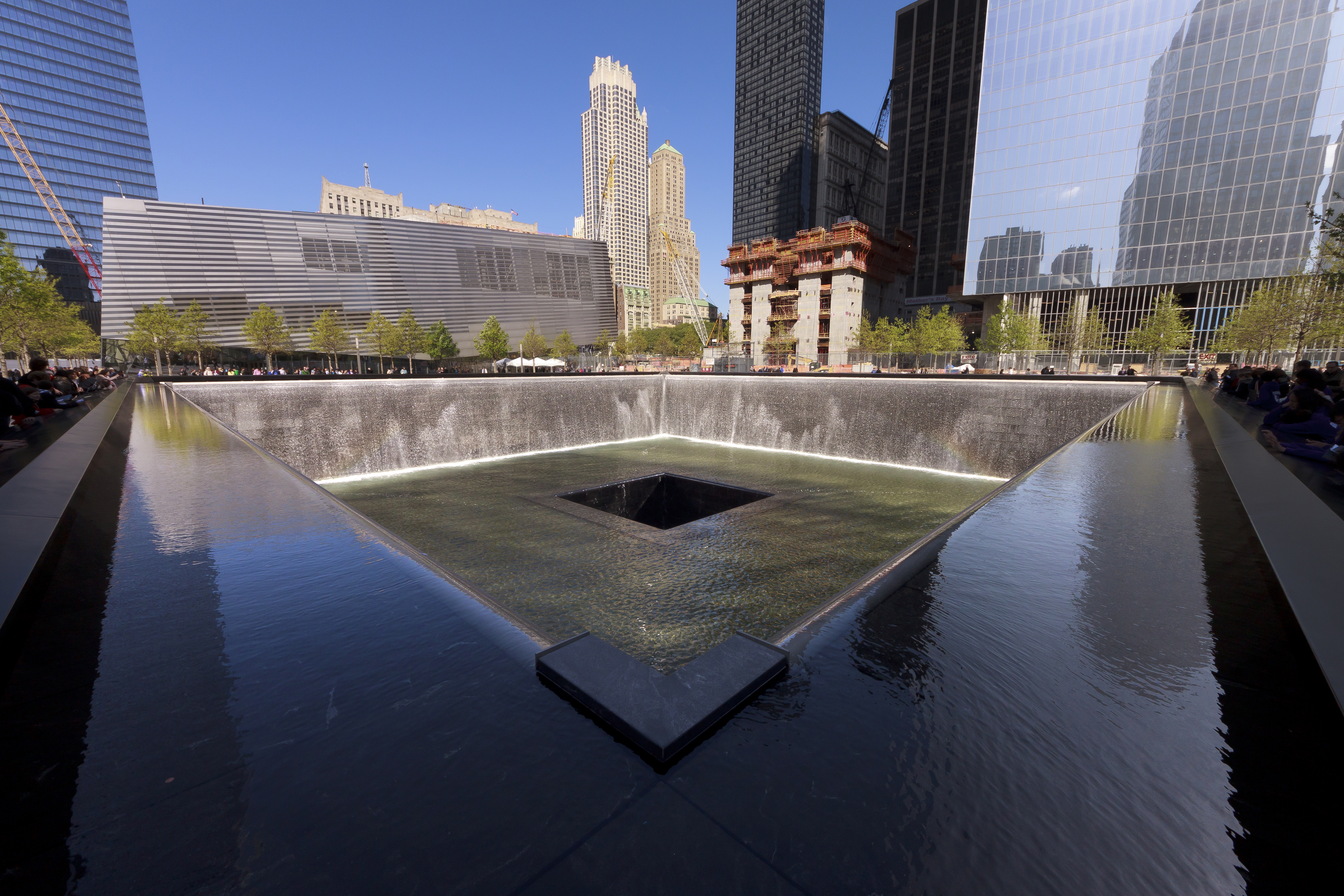 Square reflecting pool with cascading waterfalls at the 9/11 Memorial plaza in Manhattan.