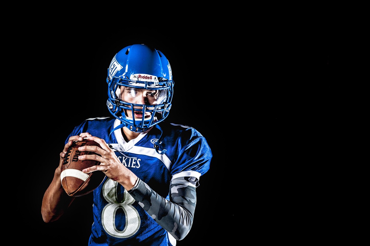 American football, athlete, ball, football, player, football player, rugby, sport, helmet, man, quarterback, uniform, je