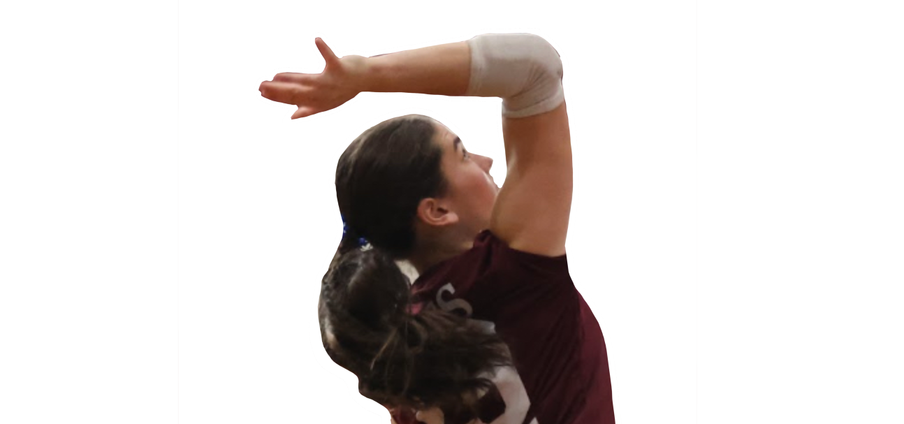 Female volleyball player in maroon uniform reaches overhead with both arms extended.