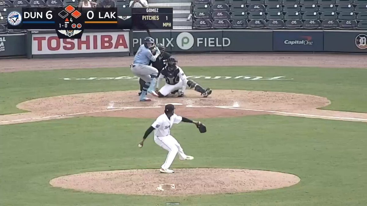 Minor league baseball game in progress with scoreboard showing home team leading six to zero.