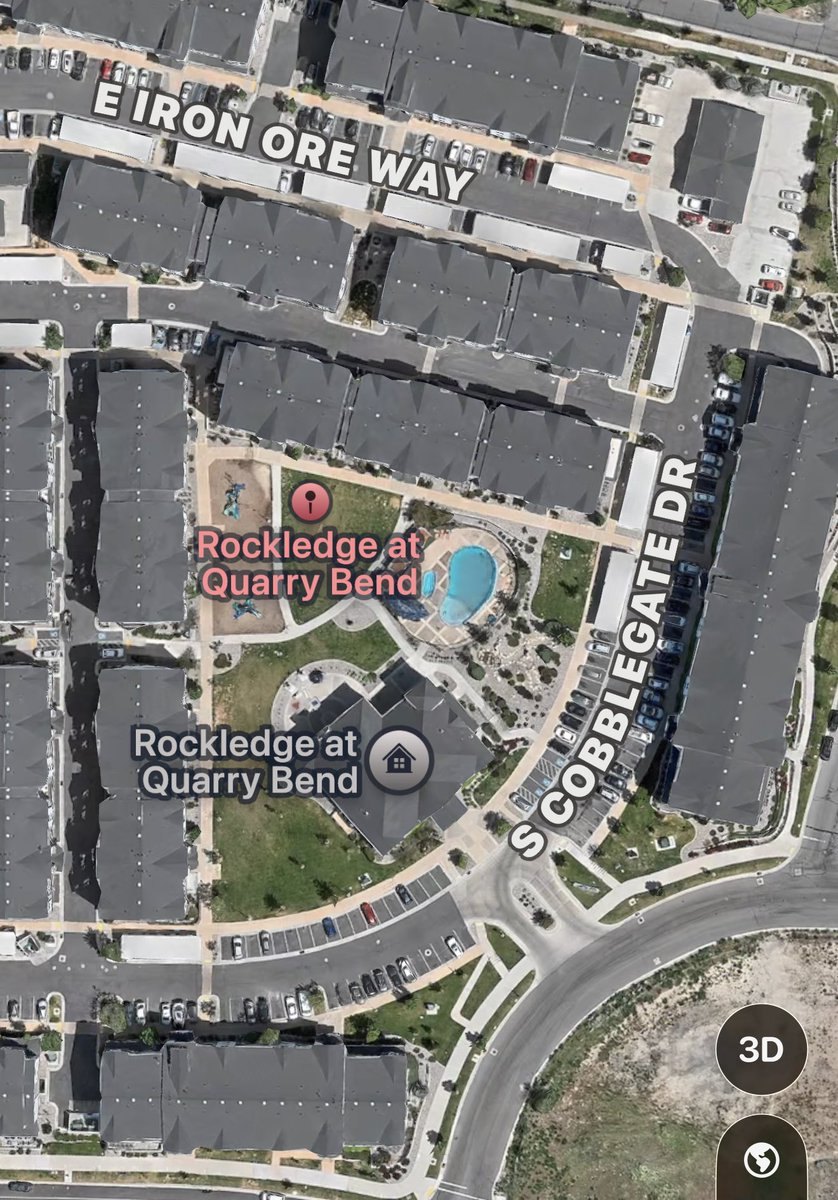 Aerial map view of an apartment complex with a visible pool area.