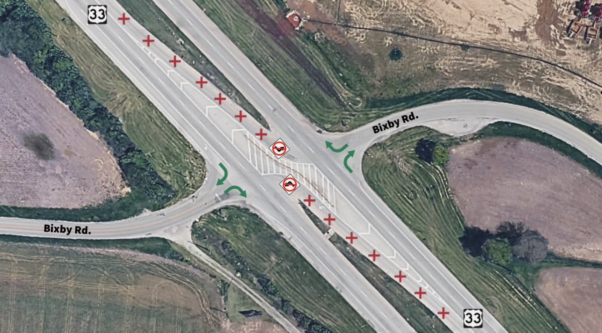 Aerial map of a highway intersection with red X markers blocking left turns and green arrows showing permitted right turns.