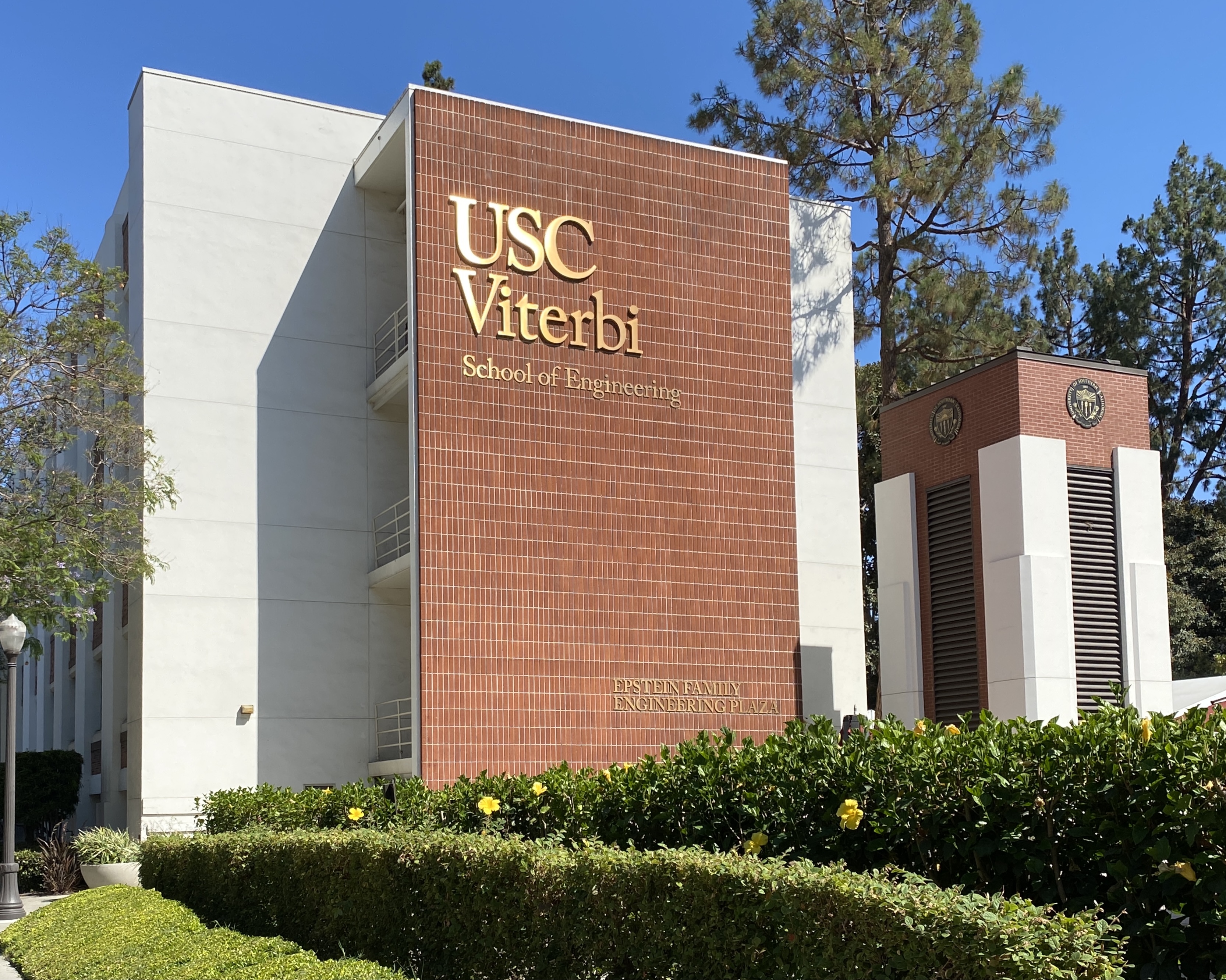 Brick building facade with gold lettering reading USC Viterbi School of Engineering.