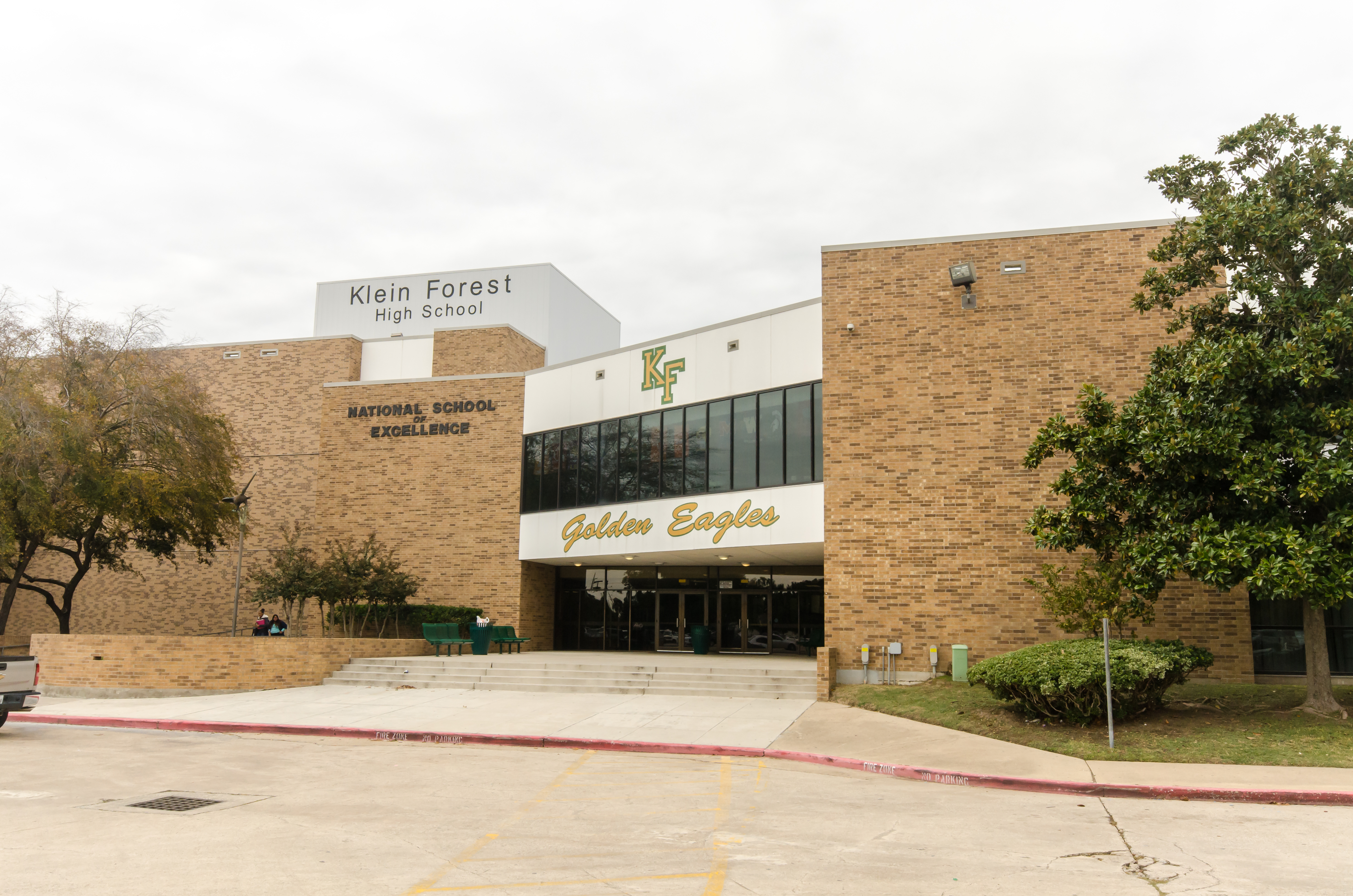 Exterior of a brick high school building with Klein Forest High School signage.