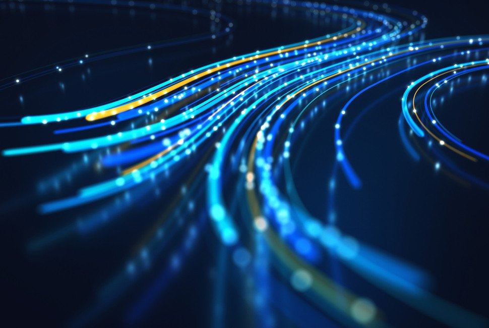Glowing blue and gold fiber-optic cable strands curve across a dark background.