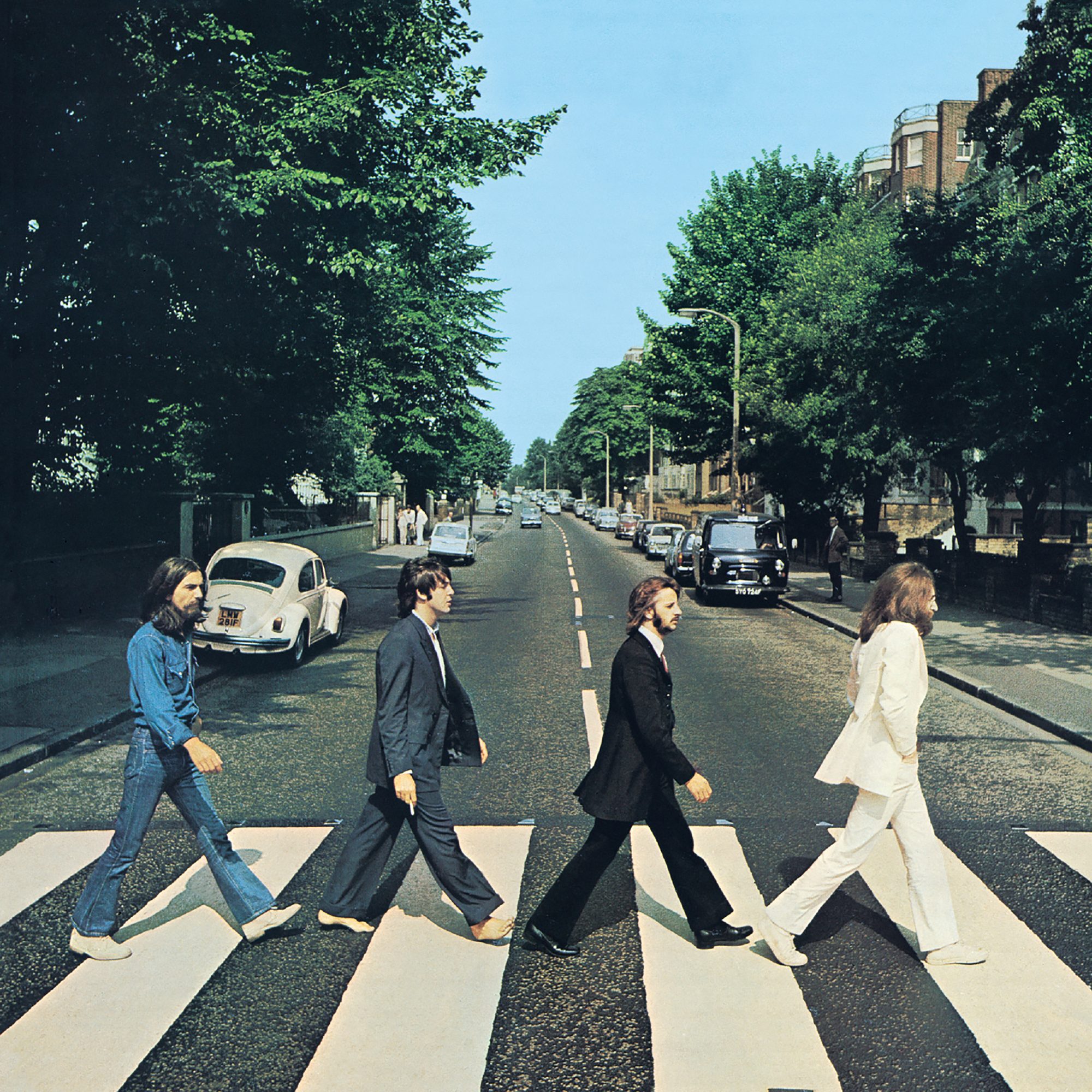 Front cover of Abbey Road by The Beatles. The view really is Abbey Road, London, NW8 looking north. The gates of the Abbey Road Studios are behind the white VW Beetle on the left.