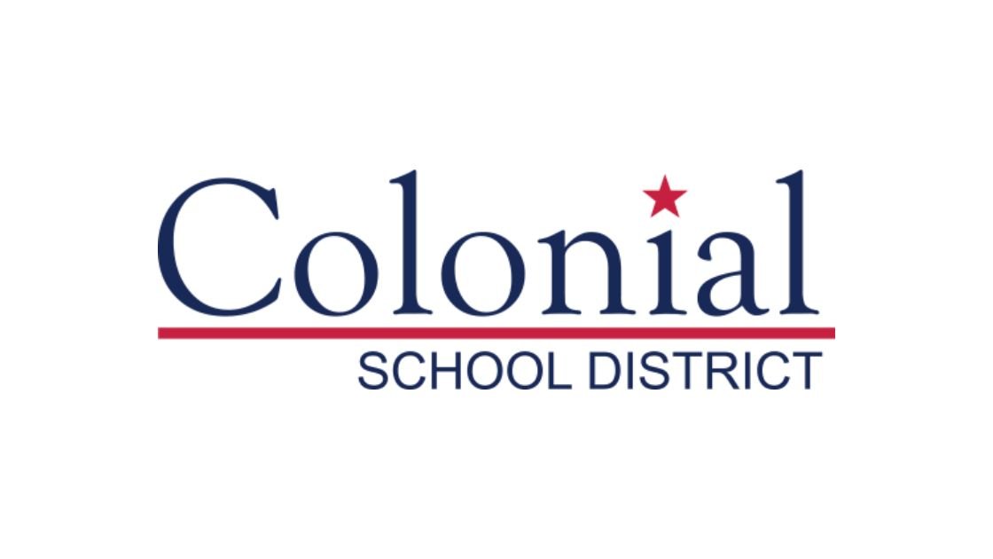 Colonial School District wordmark logo with a red star and red underline.