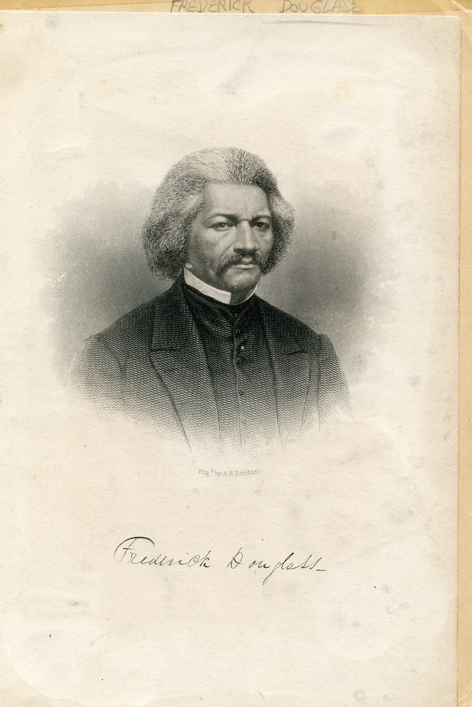Engraved portrait of a man with curly hair and a mustache, with a cursive signature below.