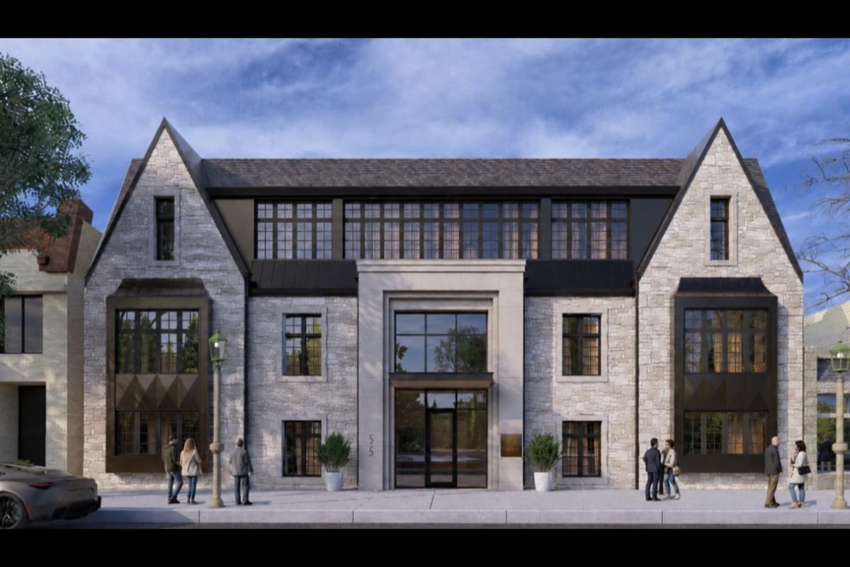 Architectural rendering of a stone and dark-metal residential building with peaked rooflines and large windows, pedestrians on sidewalk.