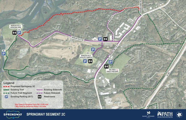 Planning map showing proposed trail route in red along a river corridor.