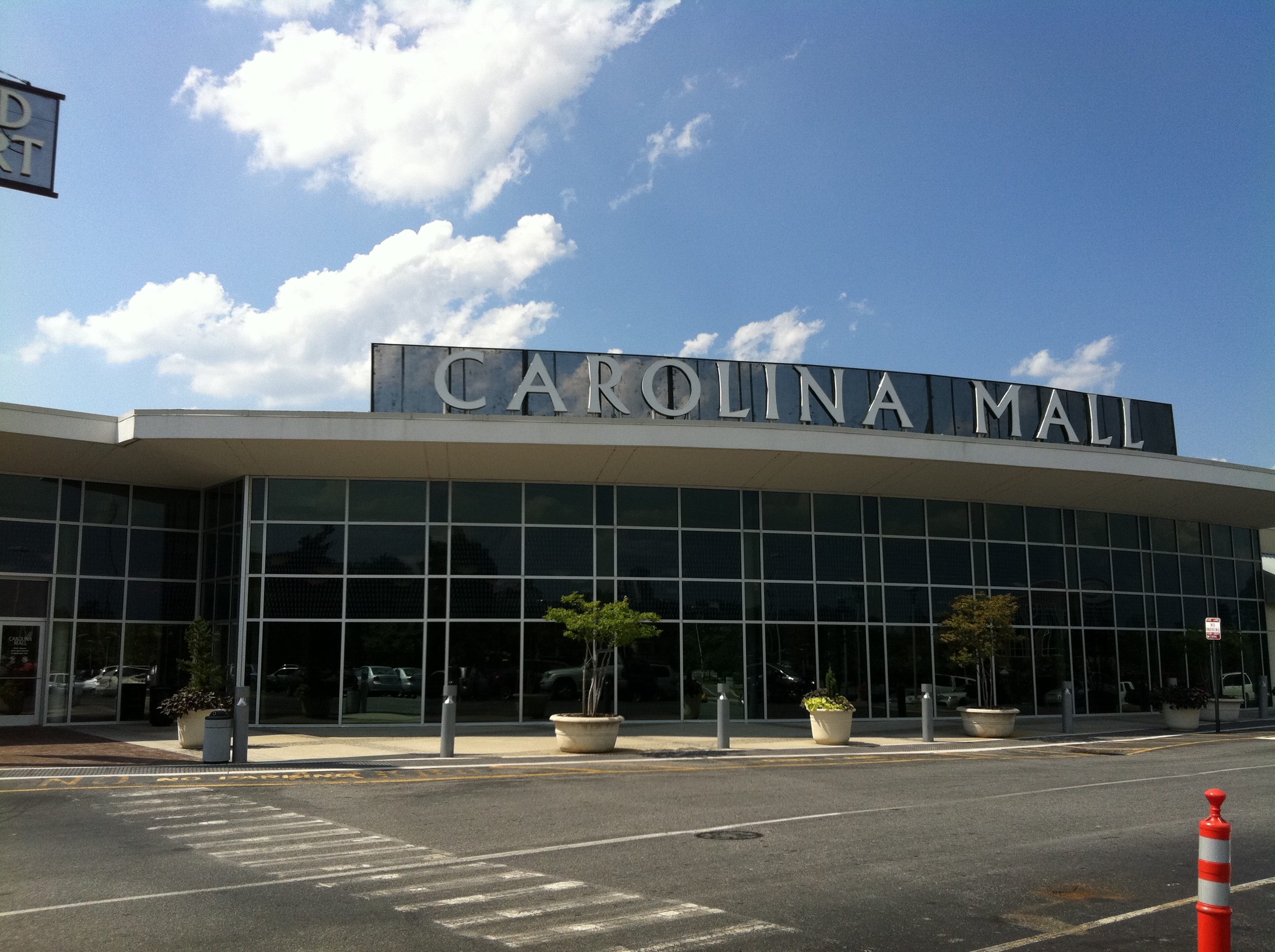 Exterior of a large retail building with 'Carolina Mall' lettering across the facade.