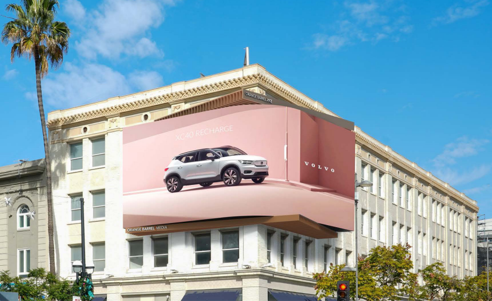 Large wraparound LED billboard on the upper corner of a white historic building with classical architectural details.