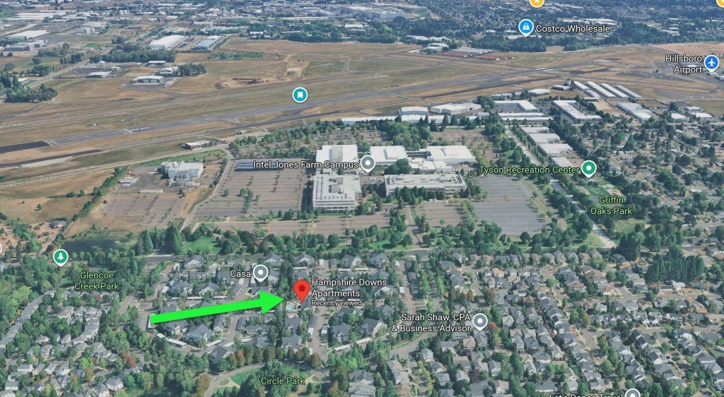 Aerial satellite view with a red pin marking an apartment complex in northeast Hillsboro.